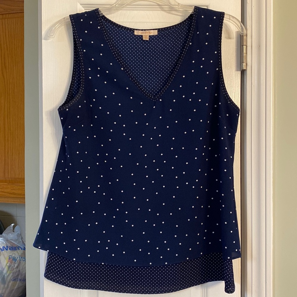 Skies are blue size, small, blue, and white V-neck sleeveless top